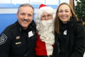 Chief Lucich, Mrs. Lucich, and Santa